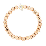 Bracciale Pepita DoDo in oro rosa 9K e argento 925 con anello brisè in oro giallo, design ispirato a pietre levigate dal mare.
